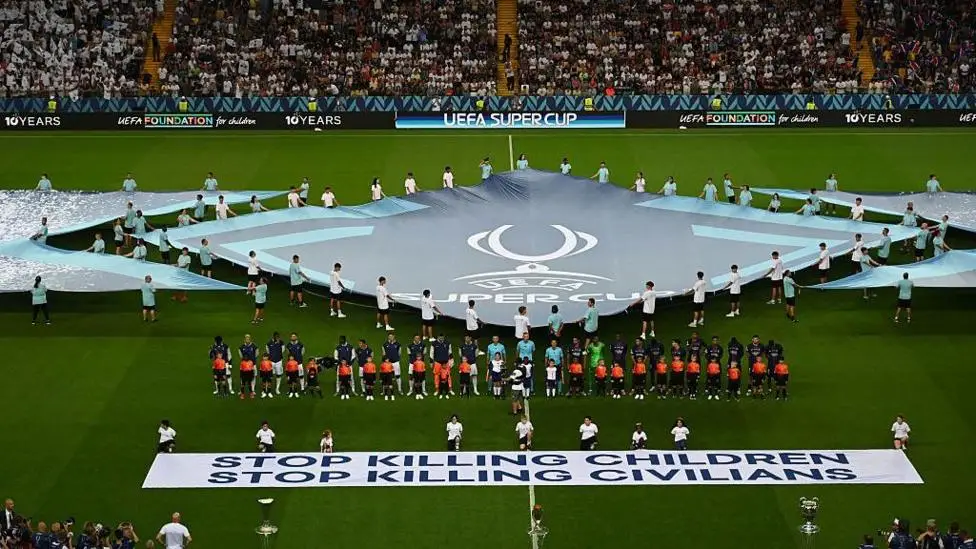 Uefa displays 'stop killing children' banner at Super Cup
