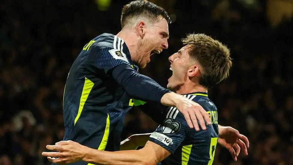 Does Gilmour have to start in Scotland midfield?