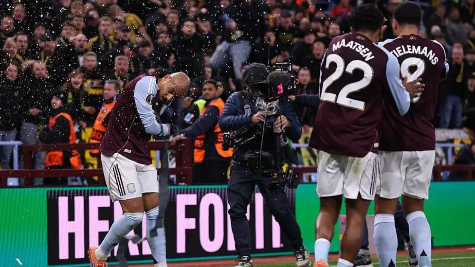 Malen hit by cup as crowd trouble halts Villa game
